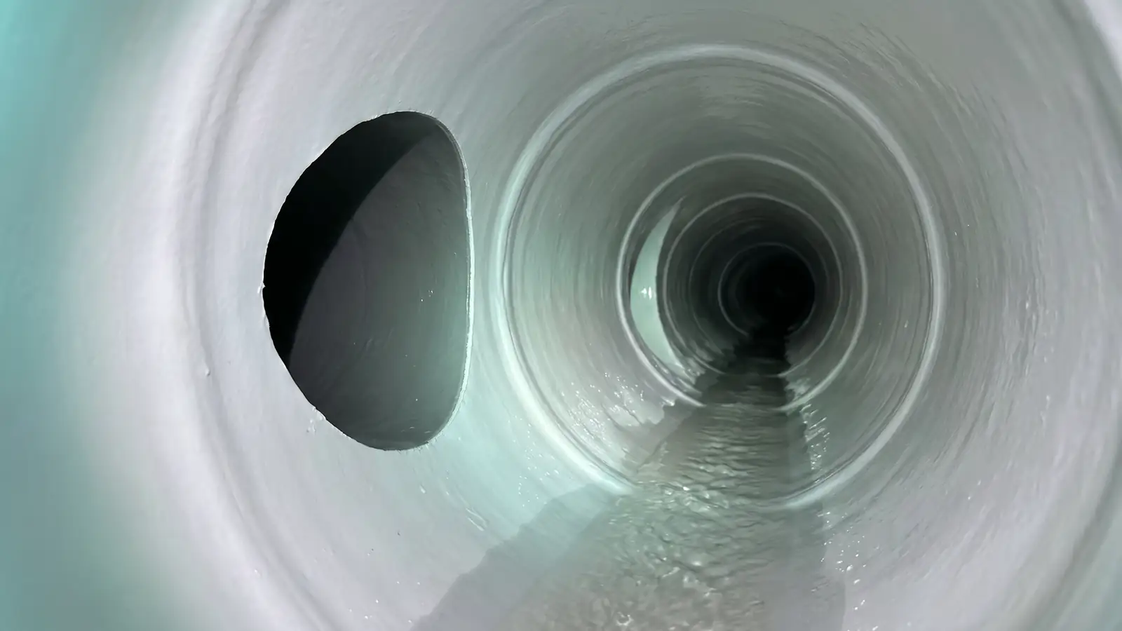 After: the same connection cleanly reopened through the liner